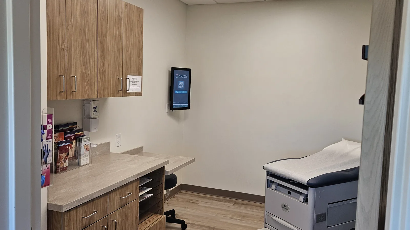 An exam room at our Akron office, with a supply counter and exam table